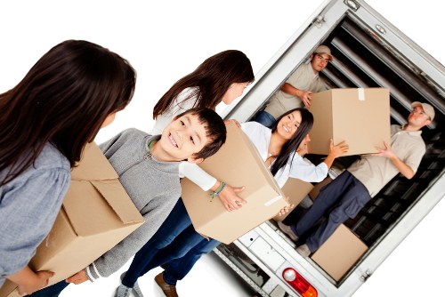 Moving van and packed boxes ready for a house move in Gallows Corner