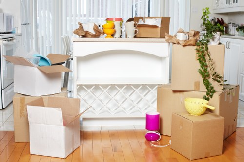 Furniture and household items being loaded into a van