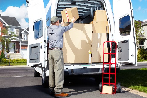 Professional movers handling furniture during a local relocation in Gallows Corner