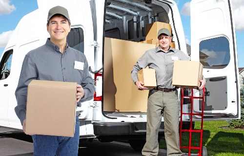 Packing boxes and preparing for a man with van move in Gallows Corner