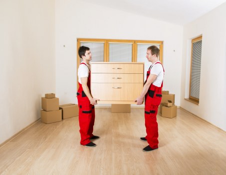 Careful wrapping and labelling of household items for relocation
